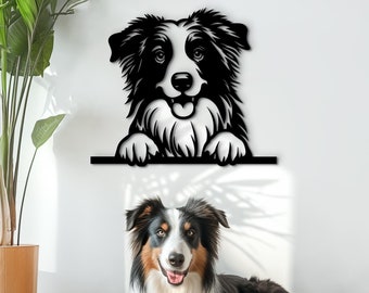 May include: Black and white silhouette of a border collie dog peeking over a wall, with a real border collie dog lying on a brown dog bed in the foreground.
