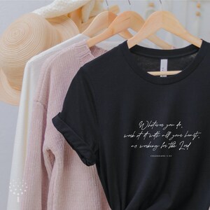 May include: Black t-shirt with white text that reads "Whatever you do, work at it with all your heart, as working for the Lord. Colossians 3:23"