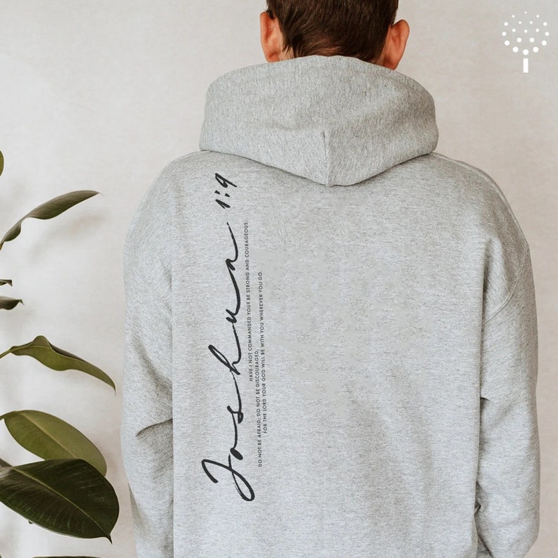 May include: Gray hooded sweatshirt with the text "Joshua 1:9" and the quote "Do not be afraid; do not be discouraged, for the Lord your God will be with you wherever you go. Have I not commanded you? Be strong and courageous." printed on the back.