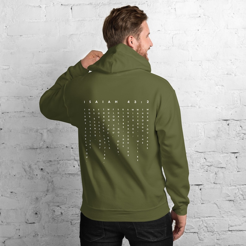 May include: A green hooded sweatshirt with a white word search puzzle on the back. The puzzle features the text "ISAIAH 43:2".