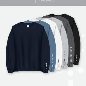 May include: Unisex crew neck sweatshirt available in navy, indigo blue, white, sport grey, dark heather, and black.