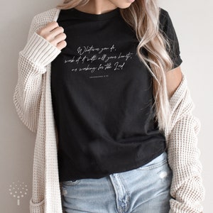 May include: Black t-shirt with white text that reads "Whatever you do, work at it with all your heart, as working for the Lord. Colossians 3:23"