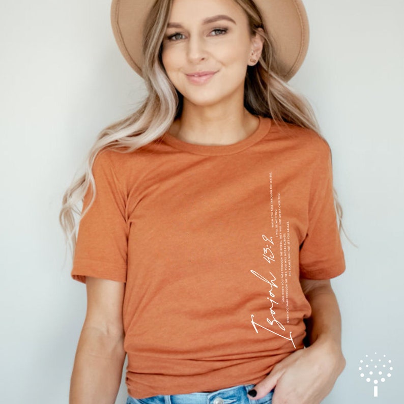 May include: A rust-colored t-shirt with a white graphic that says "Trust God 4:3:8".
