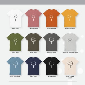 May include: A mockup of a t-shirt with a white tree graphic printed on it. The t-shirt is shown in 10 different colors: white, mauve, autumn, mustard, olive, army, asphalt, athletic heather, steel blue, navy, black, and soft cream.