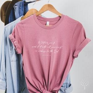 May include: A pink t-shirt with a white graphic print that reads "Whatever you do, work at it with all your heart, as working for the Lord. Colossians 3:23".