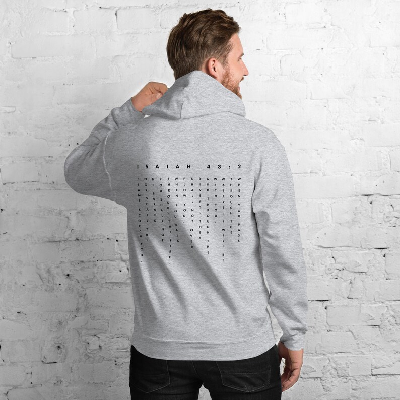 May include: Grey hooded sweatshirt with a black word search puzzle on the back. The puzzle features the text "ISAIAH 43:2".