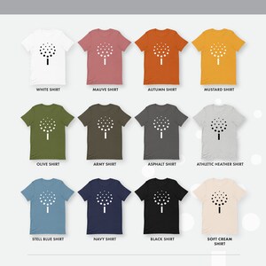 May include: A mockup of a t-shirt with a white tree graphic printed on it. The t-shirt is shown in 10 different colors: white, mauve, autumn, mustard, olive, army, asphalt, athletic heather, steel blue, navy, black, and soft cream.