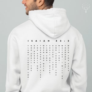 May include: White hoodie with a black print of the text "ISAIAH 43:2" and a word search puzzle with the words "FIRE" and "THE" visible.