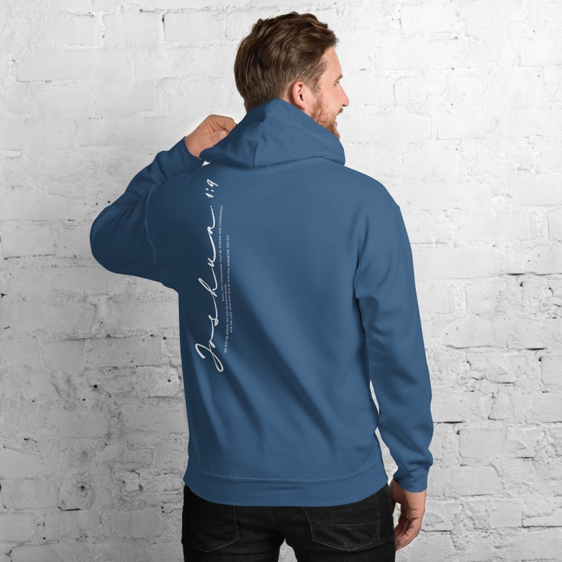 May include: A dark blue hooded sweatshirt with the text "Joshua 1:9" printed on the back in white.