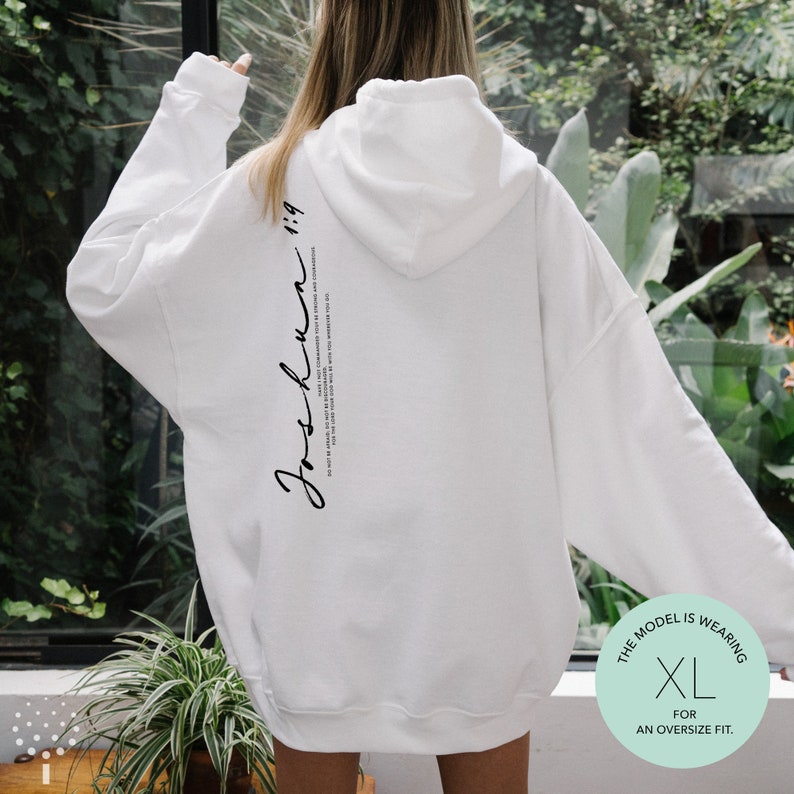 May include: White oversized hoodie with a black text print on the back that reads "Josh.Kunn 1:19". The model is wearing a size XL for an oversized fit.