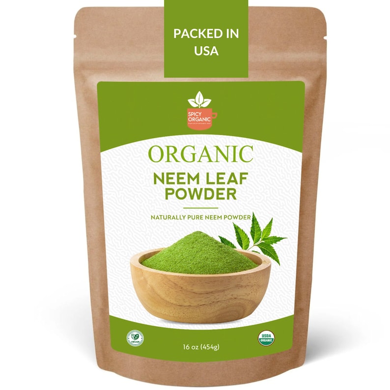 May include: A brown paper bag with a green label that reads "Organic Neem Leaf Powder" and "Naturally Pure Neem Powder". The label also features a green logo with a cup and leaf. The bag contains 16 ounces (454 grams) of powder and is packed in the USA.