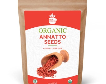 May include: A brown paper bag with a red and white label that says "Organic Annatto Seeds" and "Naturally Pure Spice". The label also has a small image of a cup with leaves and the words "Spicy Organic". The bag contains 4 ounces (113 grams) of annatto seeds.