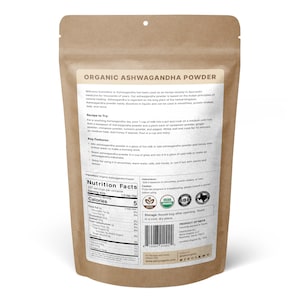 May include: A brown paper bag with a resealable top containing organic Ashwagandha powder. The bag features a label with the product name, ingredients, nutritional information, and instructions for use. The label also includes USDA Organic and SBE certifications.