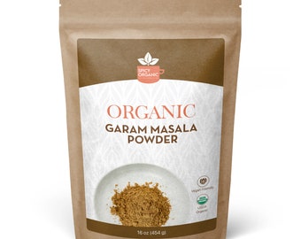May include: A brown paper bag with a white label that says "Organic Garam Masala Powder" and has a picture of the spice powder. The label also says "16 oz (454 g)", "Vegan Friendly", and "USDA Organic".