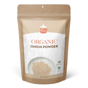May include: A brown paper bag with a white label that says "ORGANIC ONION POWDER" and has a picture of a bowl of onion powder. The label also says "16 oz (454 g)", "Vegan Friendly", and "USDA Organic".