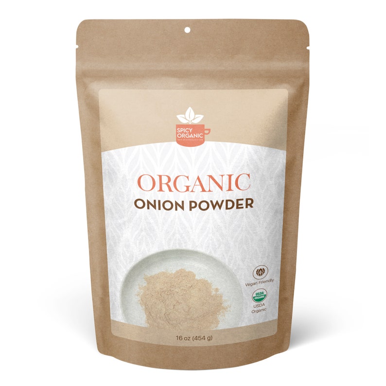 May include: A brown paper bag with a white label that says "ORGANIC ONION POWDER" and has a picture of a bowl of onion powder. The label also says "16 oz (454 g)", "Vegan Friendly", and "USDA Organic".