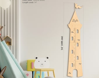 May include: A wooden castle-shaped growth chart with a flag on top, measuring up to 74 inches. The chart is painted in a natural wood color and has the name "Layla" written on it.