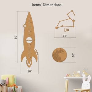 May include: A wooden rocket ship height chart with a personalized name, a wooden moon, and a wooden constellation of Leo. The rocket ship is 50 inches tall and 16 inches wide. The moon is 10 inches in diameter. The constellation is 15 inches wide.