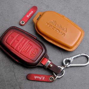 thumbnail image 2 of Toyota Tacoma Oval Leather Key Chain – Black, Genuine Toyota (KC3210.TAC) 2 of 2