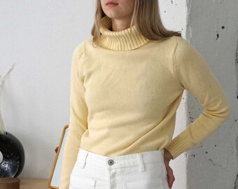 light yellow sweater