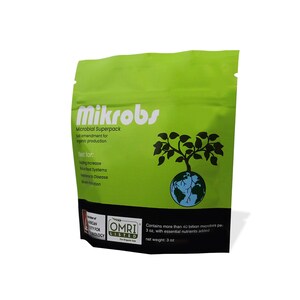 May include: Green pouch with a white logo that says "Mikrobs Microbial Superpack". The pouch has a black and white image of a tree growing out of a globe. The text "Best for: Yield Increase, Root Systems, Resistance to Disease, Growth Promotion" is printed on the pouch. The pouch also has a green and white "OMRI Listed" logo.