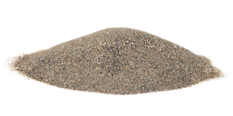 May include: A pile of gray sand with a slightly brown tint. The sand is fine-grained and appears to be dry.