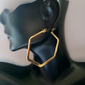 Gold Hoops Pentagon Shaped. Gold Plated Stainless Steel, Approx 1.5 in. Hygienic,durable and Hypoallergenic. Non-tarnish.