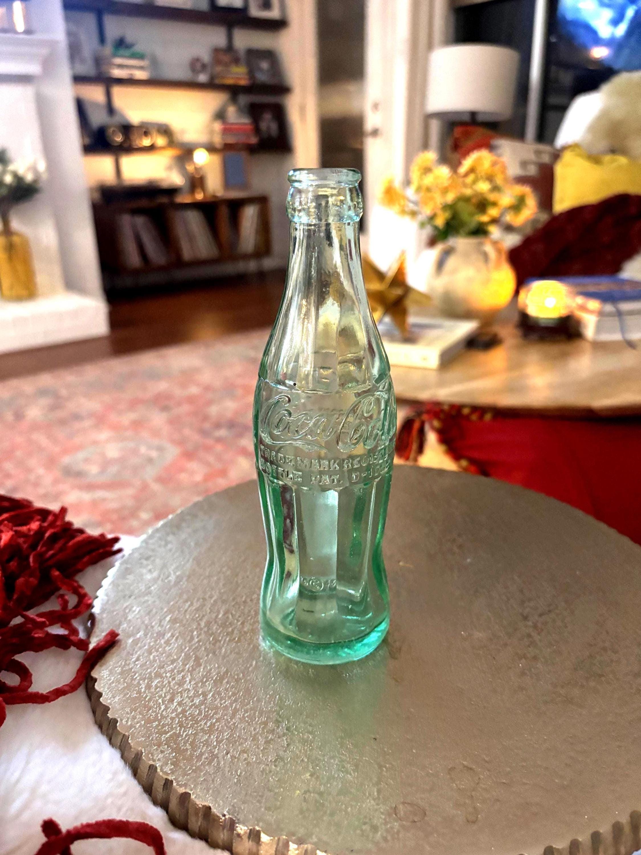ER i  Writing says “trademark registered, bottle pat. D - 105529” and