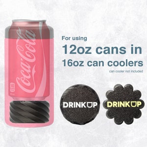 May include: A pink 12-ounce can of Coca-Cola with a black Drink Up can cooler adapter. The adapter is designed to fit 12-ounce cans into 16-ounce can coolers. The text "For using 12oz cans in 16oz can coolers" is displayed above the image. The text "can cooler not included" is displayed below the image.