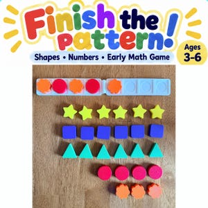 May include: An early math game titled Finish the pattern! Shapes Numbers Early Math Game Ages 3-6. Includes a white ten-frame tray with orange and red circular tokens, plus loose yellow stars, purple squares, green triangles, red circles, and orange flowers.