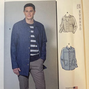 May include: McCall's sewing pattern M8352 featuring a man wearing a blue jacket and gray pants. The pattern includes multiple view options with simple instructions. Size AA (34-36-38-40-42). Designed and printed in the USA.