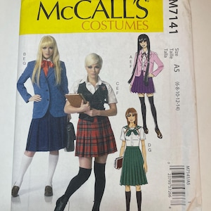 May include: A McCall's Costumes sewing pattern envelope M7141, size A5 (6-8-10-12-14). The front features illustrations of four different school-style outfits including blazers, pleated skirts, vests, and collared shirts, with a barcode on the bottom right.