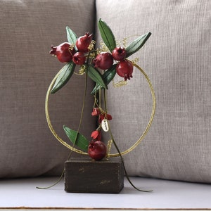 Table top handcrafted ornament Pomegranate. Symbol of plently, youth, good luck and fertility. The famous red fruit in Greek mythology.