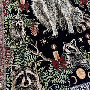 Raccoon gifts for women dont get any better than this raccoon woven blanket with a black background, Christmas candles, stars and moons and botanical leaves