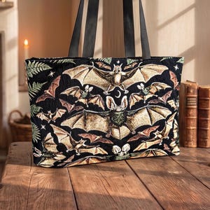 victorian gothic tote bag with bats woven into a black background