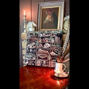 Spooky season book lovers tote bag! Apothecary cabinet design woven into the front and back of a tapestry tote bag.