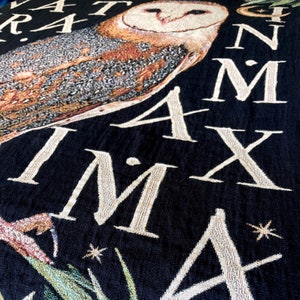 Owl decor barn owl woven blanket for bird lovers. The latin saying NATURA MINIMA IN MAXIMA meaning Nature is the greatest in the smallest is woven in to this cotton tapestry blanket with a large barn owl in the center.