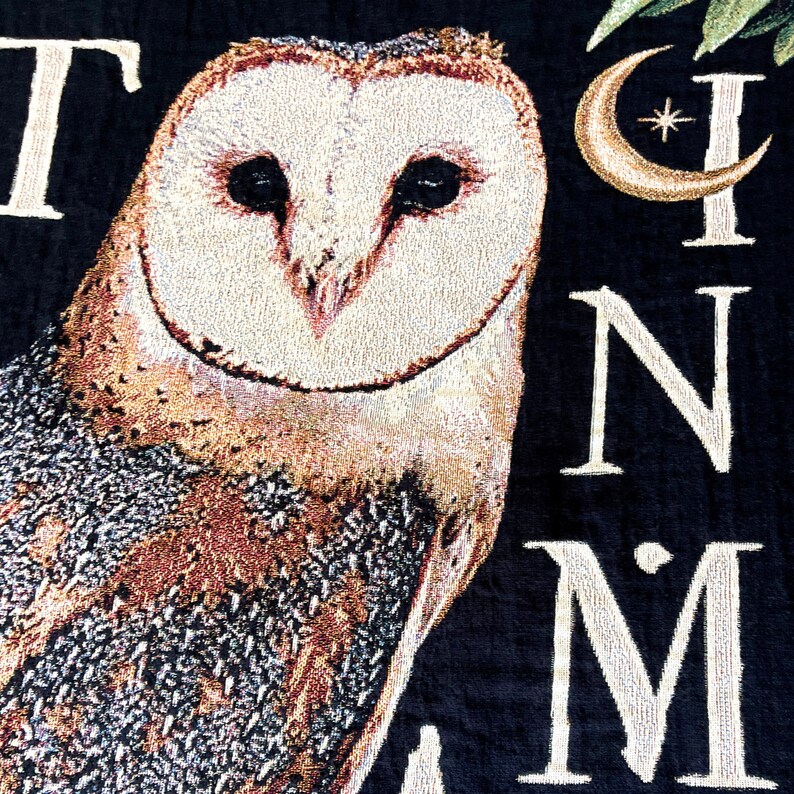 Bird decor for owl decor lovers. Nature inspired decor woven tapestry blanket with barn owl and latin saying Natura in Minima Maxima. This all cotton woven blanket with fringe around the edges is the perfect literary gift for fans of bookish merch to use in their cozy book nooks.