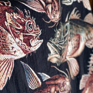 Antique fisherman aesthetic decor. Fishing gift for him. Black woven tapestry blanket with several deep sea fish woven in.