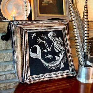 Dark Mermaid Skeleton Tote. Mermaidcore tote bag. Mermaid core woven tapestry tote with a black background and vintage frame surround. Double layered and sturdy with the design woven on the front and back.