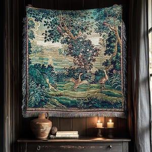 May include: A rectangular woven tapestry wall hanging featuring a detailed landscape scene with lush green trees, a fountain, and various birds including a large goose in the foreground. The textile has a fringed edge and a dark, moody color palette.