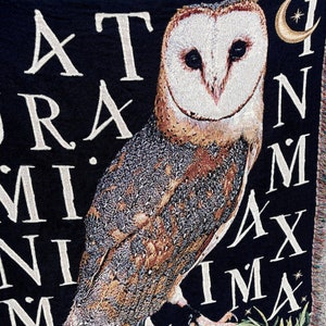 The latin phrase Natura in Minima Maxima woven into the background of this dark academia decor woven blanket means In Nature is the greatest in the smallest things making this woven throw blanket the perfect gift for nature lovers.
