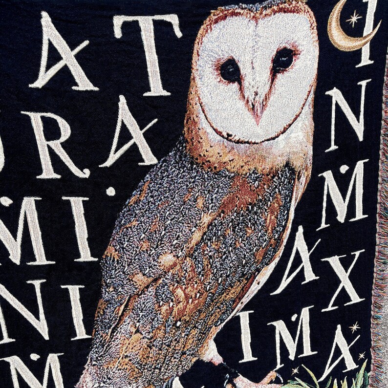 The latin phrase Natura in Minima Maxima woven into the background of this dark academia decor woven blanket means In Nature is the greatest in the smallest things making this woven throw blanket the perfect gift for nature lovers.