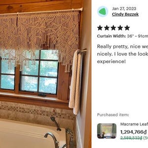 May include: A cream white macrame window curtain featuring a detailed leaf pattern and hanging fringe. The curtain is suspended from a white rod and measures 36 inches in width, providing a decorative covering for a window above a bathtub.
