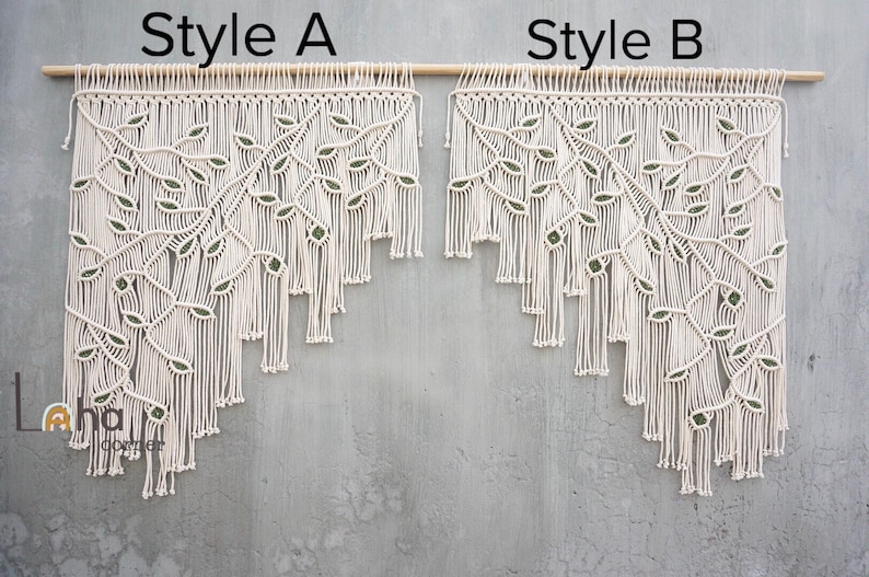 May include: Two off-white macrame wall hangings labeled Style A and Style B, both suspended from a wooden rod. Each piece features a branch design with green leaf accents and a tiered fringe bottom. The text Laha corner is visible in the lower left.