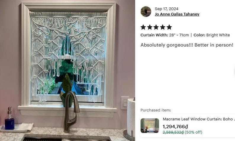 May include: A bright white macrame window curtain featuring a knotted leaf pattern with long, loose fringe hanging from a rod. The curtain measures 28 inches in width and is displayed covering a window pane, showcasing intricate fiber art knots.