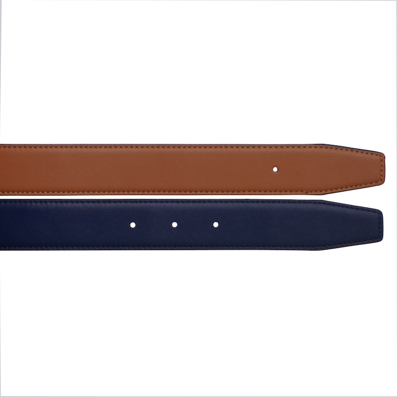 May include: A brown leather belt with a navy blue leather strap. The belt has a single hole for adjusting the fit.