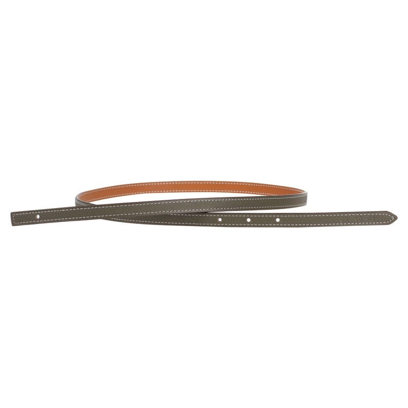 May include: A brown leather belt with a tan leather lining and white stitching.