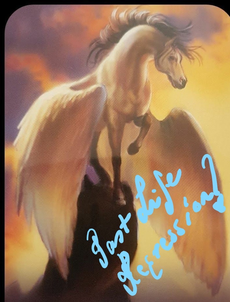 May include: A white winged horse with a black mane and tail stands on a rock against a sunset background. The words "past life regressions" are written in blue on the image.