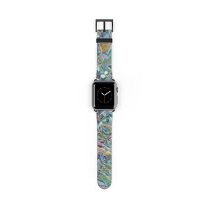 May include: A colorful abstract pattern Apple Watch band with a black buckle. The watch face is black with white hands and a silver case.